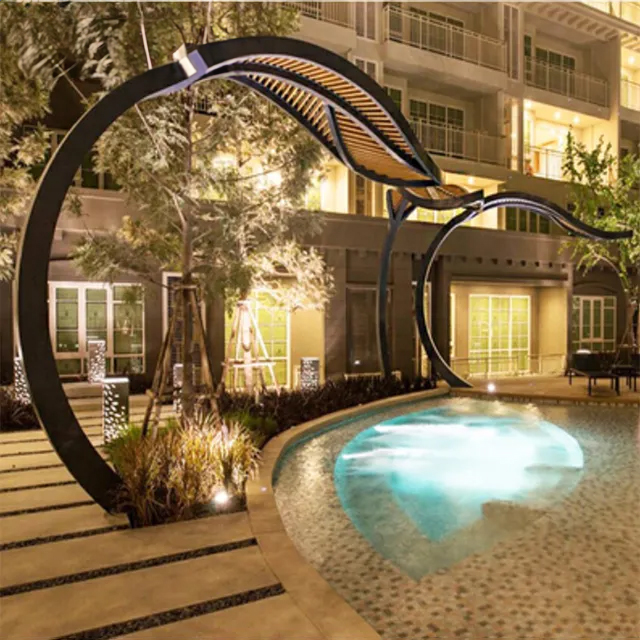 Night view of a leaf-inspired Stainless Steel Canopy for Sale