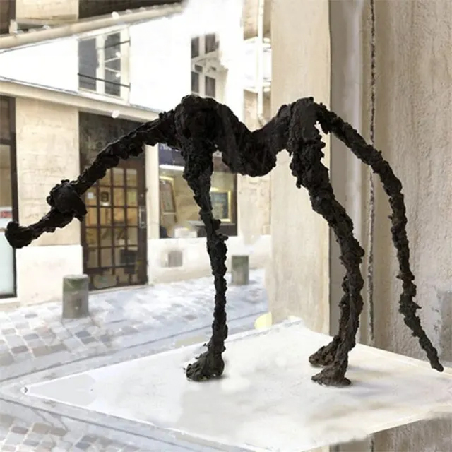 Outdoor Abstract Dog Statue with thin, elongated form and rough bronze surface