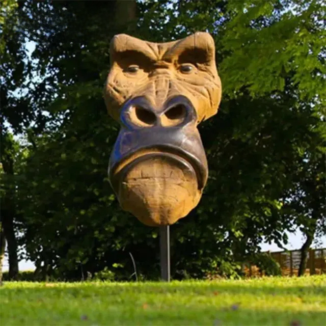 Bronze Gorilla Bust statue in front of a classical French building