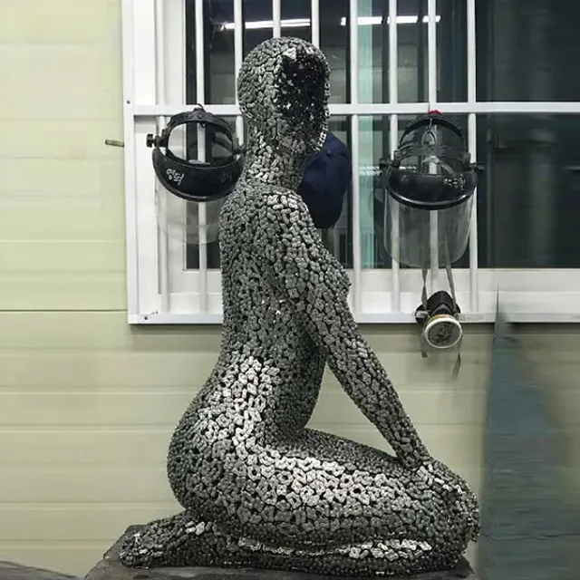 Sculpture Female Figure kneeling pose made of stainless steel chains