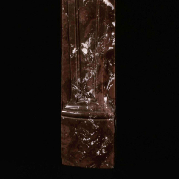 Side detail of carved red marble Louis XV Fireplace Mantel leg