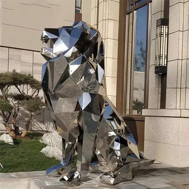 Side view of a stainless steel lion sculpture with a geometric low-poly design