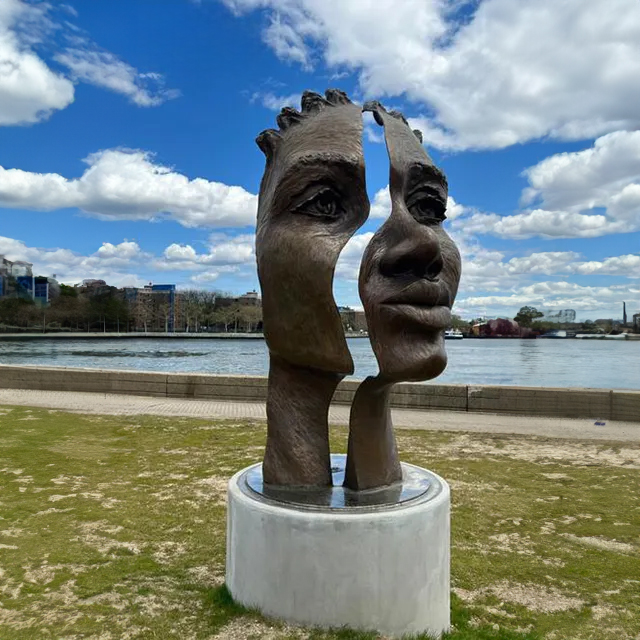 Split bronze Female Statue Face sculpture from The Girl Puzzle by Amanda Matthews