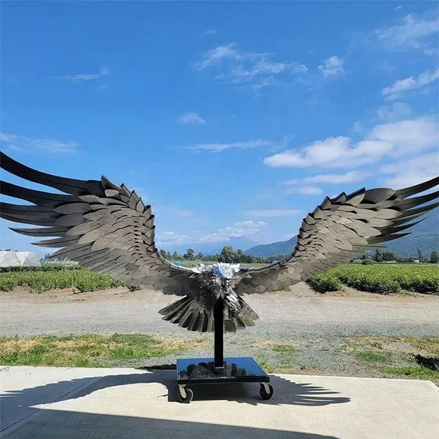 Stainless Steel Eagle Sculpture spreading wings, crafted from layered steel feathers