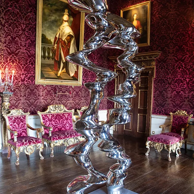 Stainless steel Tony Cragg Statue featuring dynamic twisting forms