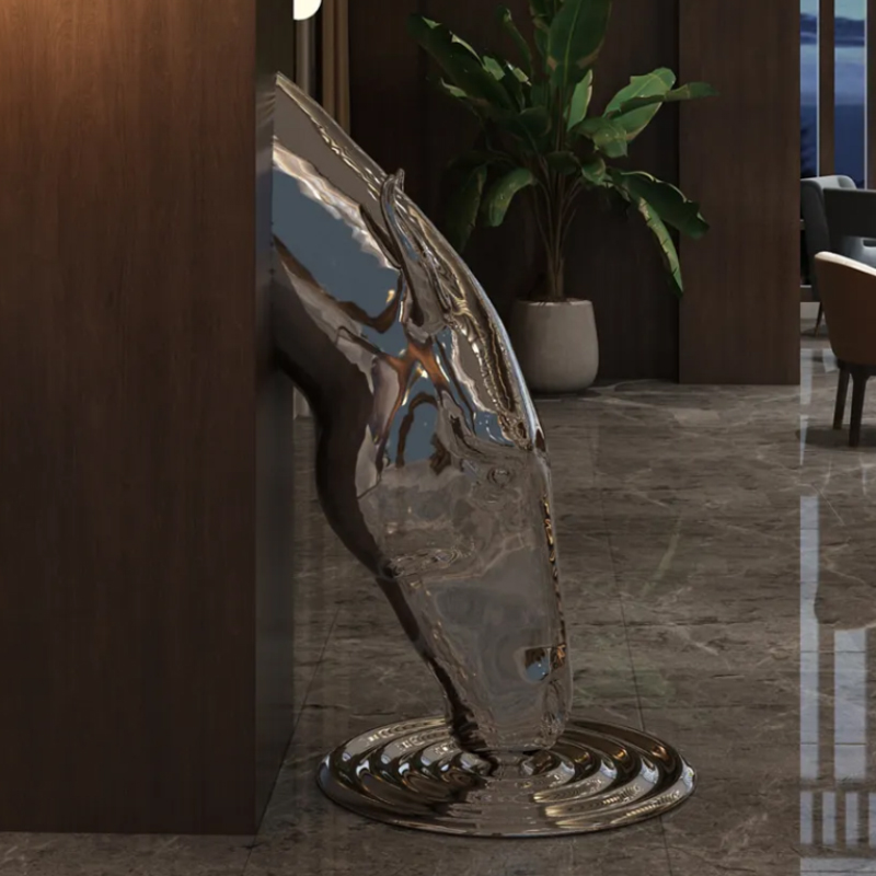 Stainless steel horse head sculpture showing front view with ripple base