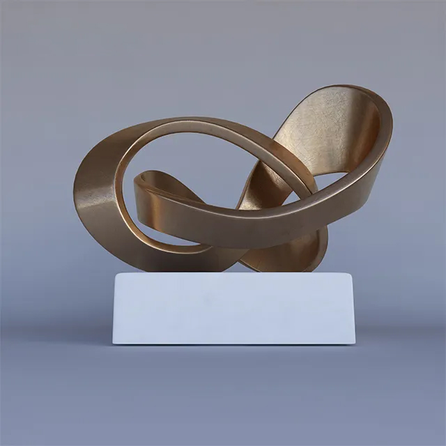 Studio view of Abstract Bronze Sculpture for Sale with flowing ribbon design and white base