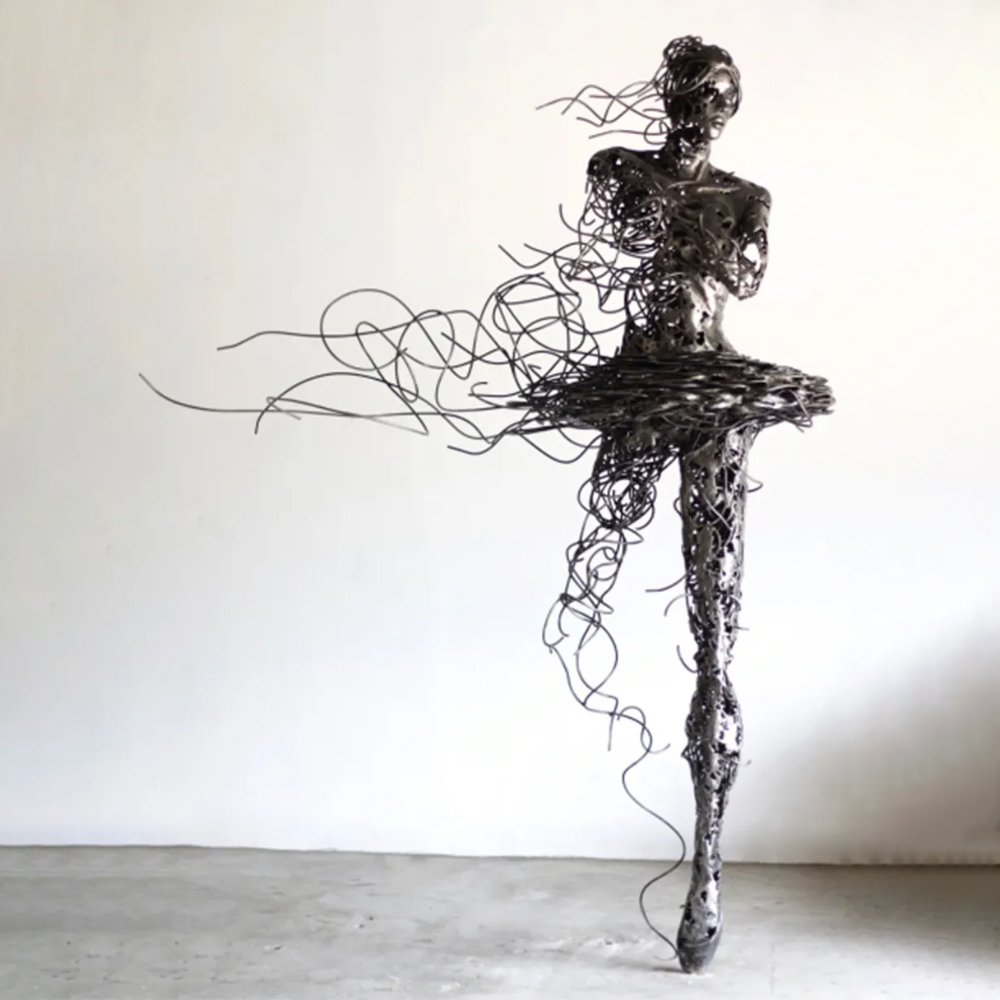 Wire Ballerina Sculpture with stainless steel strands flowing from the figure