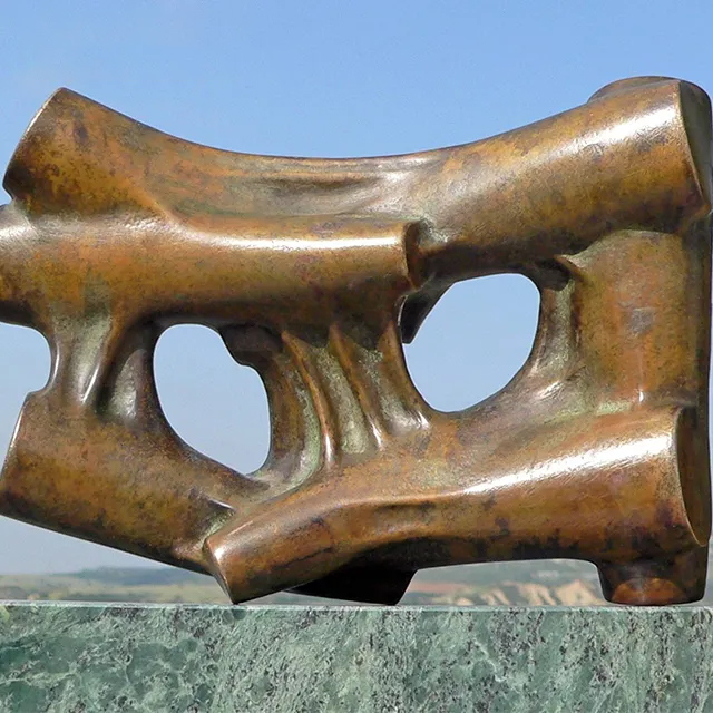 bronze Abstract Shape Sculpture featuring smooth circular joints