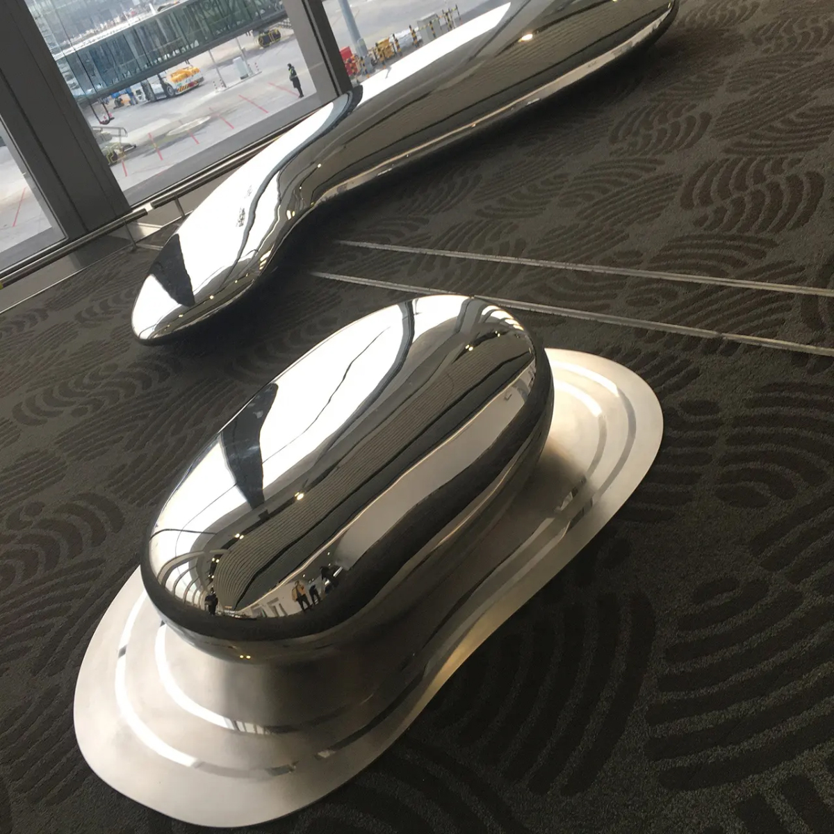 pebble-inspired polished steel sculpture