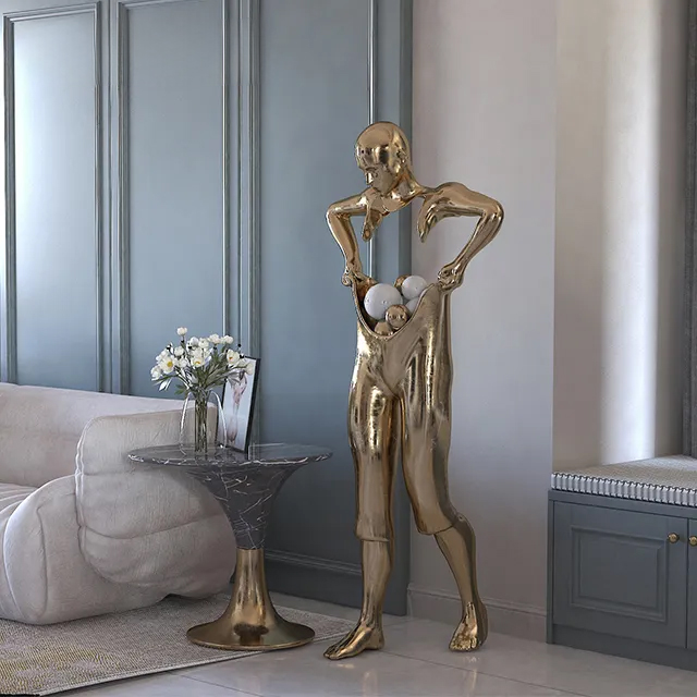 stainless Steel Man Statue with a golden mirror-polished finish