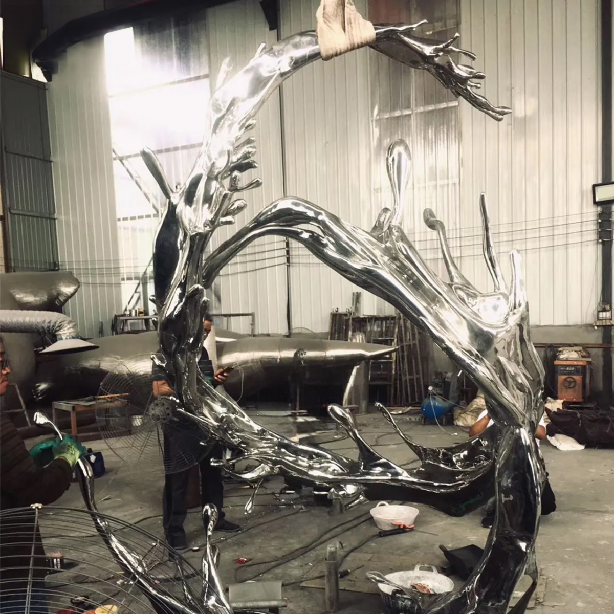 stainless steel Wave Statue’s organic flowing shapes