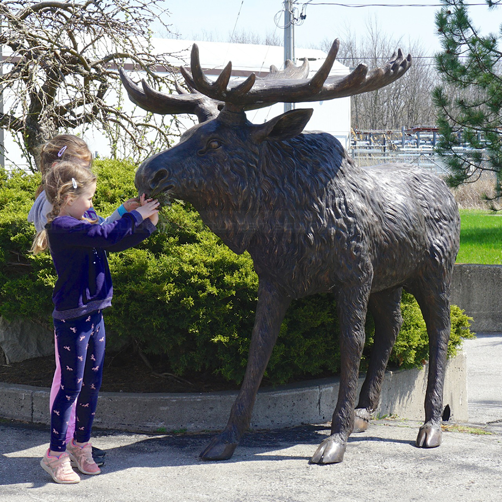 4.1.1 5ft Bronze moose statue outdoors with children