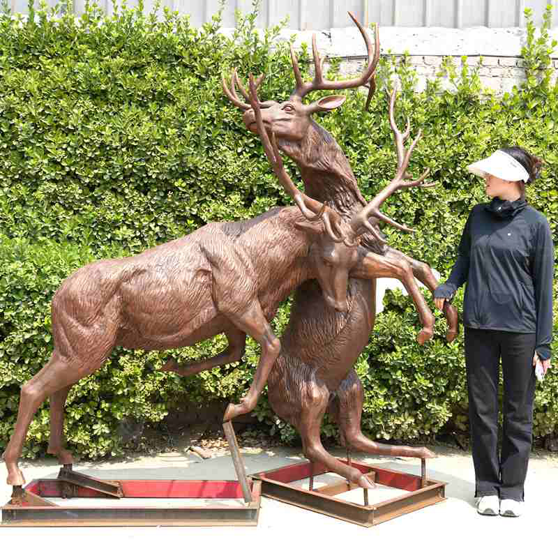4.1.2-6ft-bronze-deer-fighting-statue-with-antlers-beside-adult-woman
