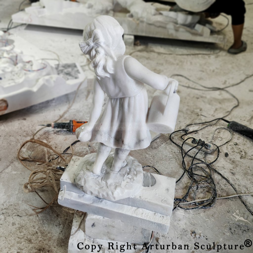 5-Girl Watering Flower Statue being hand-carved in marble