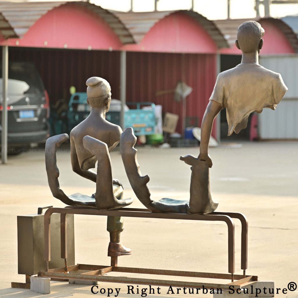 6-Rear view of Les Voyageurs Sculpture in bronze