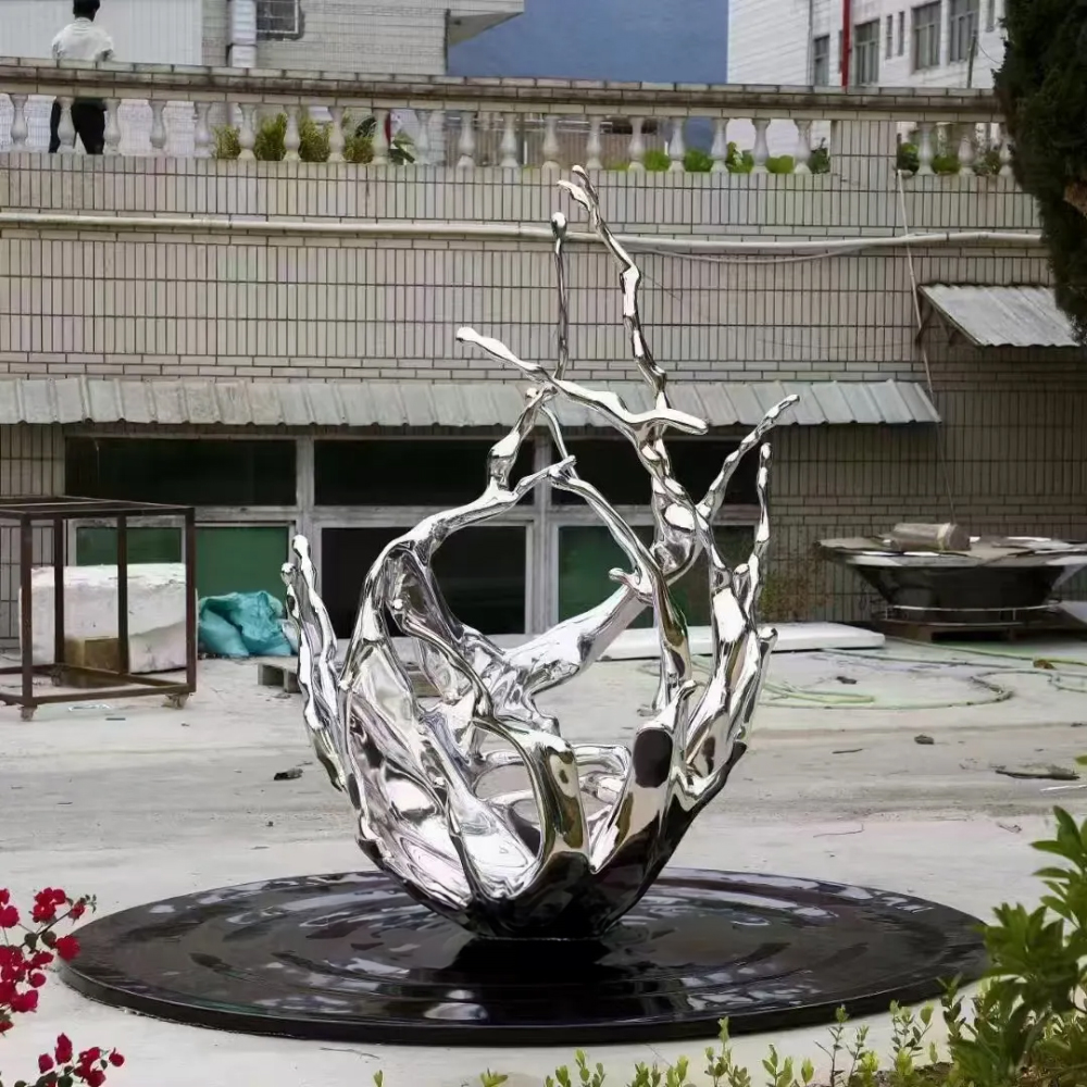 Abstract Water Statue made of polished stainless steel, capturing a dramatic splash effect