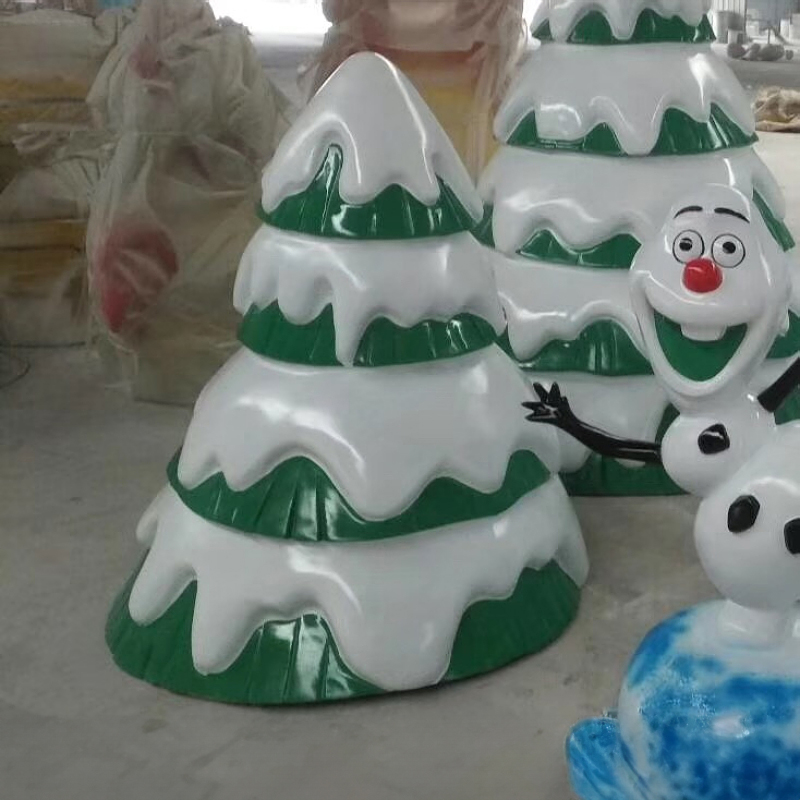 An Evergreen Tree Statue made of fiberglass, featuring green tree layers covered with white snow