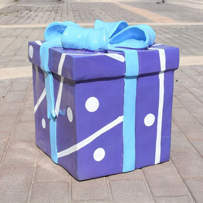 Blue fiberglass Gift Box Sculpture decorated with white dots and stripes