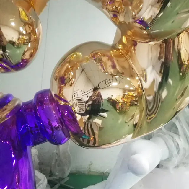 Close-up of Jeff Koons Popeye Statue's golden arm