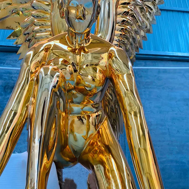 Close-up of gold stainless steel angel sculpture