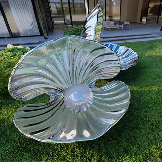 Close-up view of a modern Shell Statue made of stainless steel