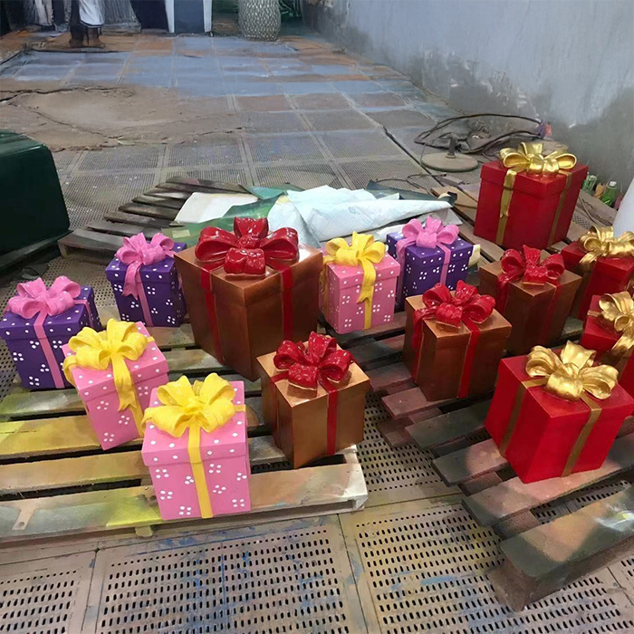 Colorful Fiberglass Gift Box Sculpture set with bows in red, pink, purple, and gold