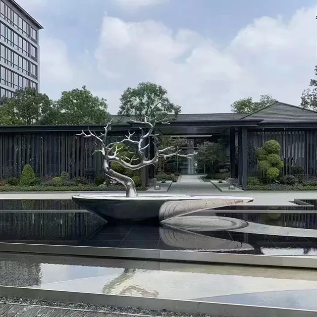 Contemporary stainless steel Pine Tree Sculpture set on a sculptural boat