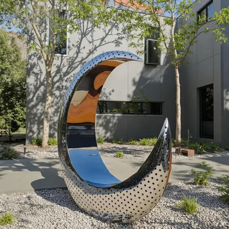 Crescent Sculpture made of polished stainless steel with perforated design