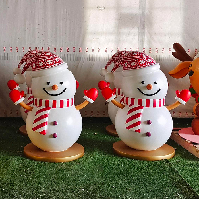 Cute Fiberglass Snowman Christmas Figurines wearing Santa hats and red gloves