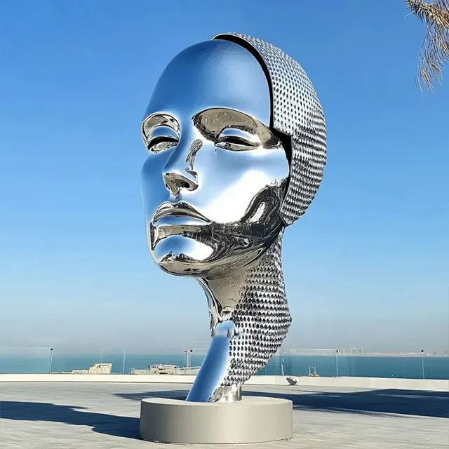 Elegant stainless steel Large Face Sculpture with serene expression