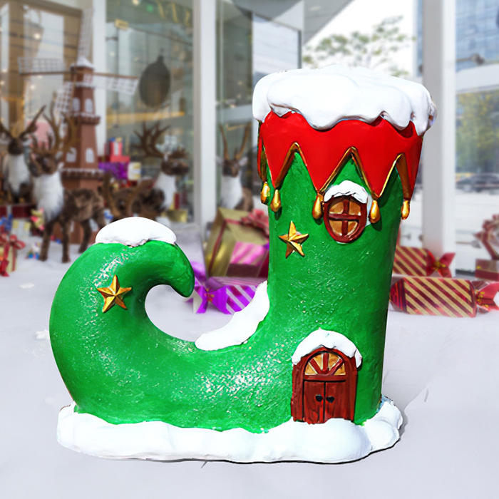 Elf Boot Sculpture in green with red trim and golden star details,