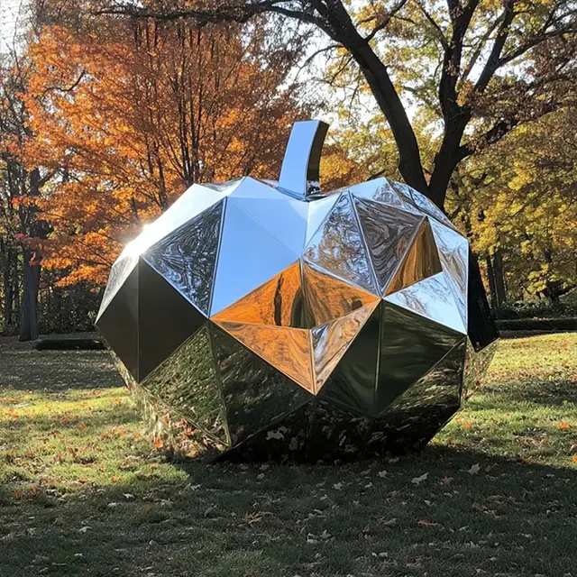 Faceted stainless steel Metal Pumpkin Sculpture with geometric polygon surfaces