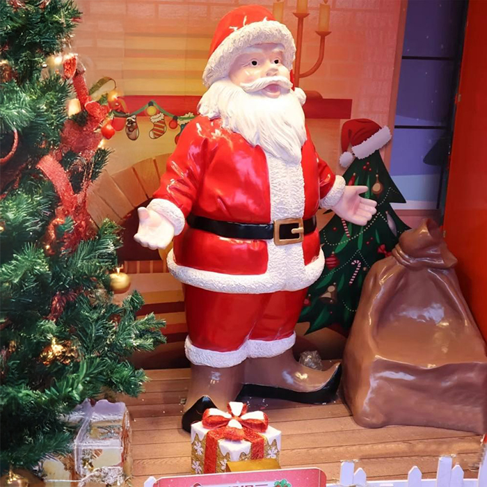 Fiberglass Christmas Snowman Statues showing a Santa Claus with a gift sack