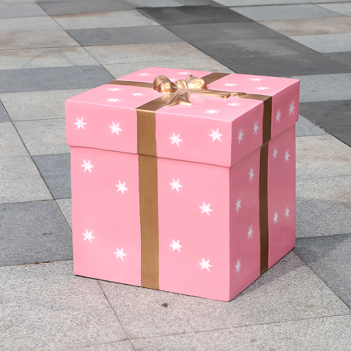 Fiberglass Large Christmas Box Decoration in pink with white star patterns and golden ribbon