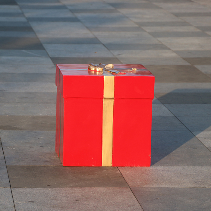 Fiberglass Large Christmas Box Decoration in solid red with golden ribbon and bow