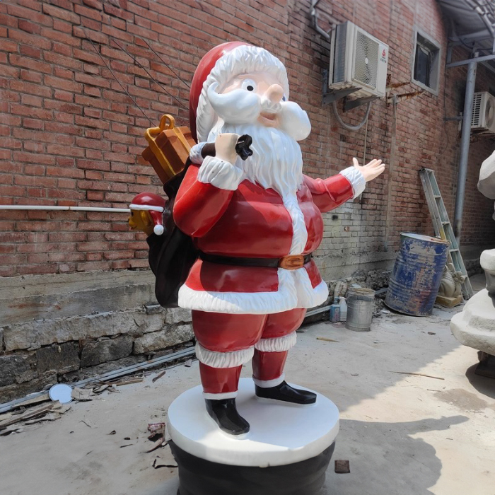 Fiberglass Large Santa Figurine carrying a gift bag