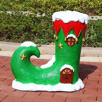Fiberglass Outdoor Christmas Sculptures shaped as green holiday boots with red and gold trim