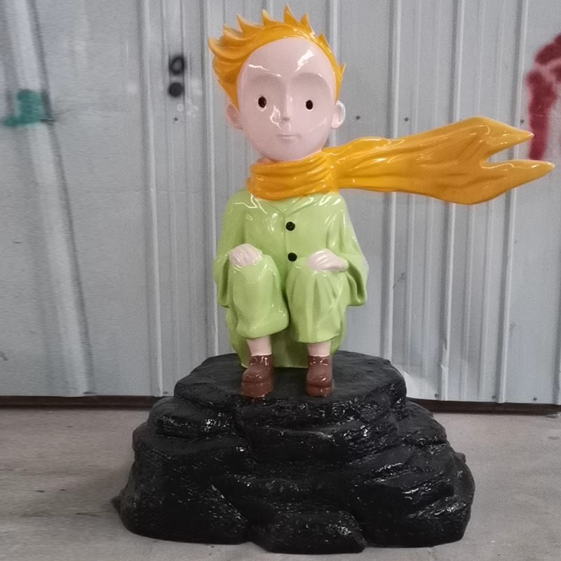 Fiberglass The Little Prince Sculpture sitting on black rock base