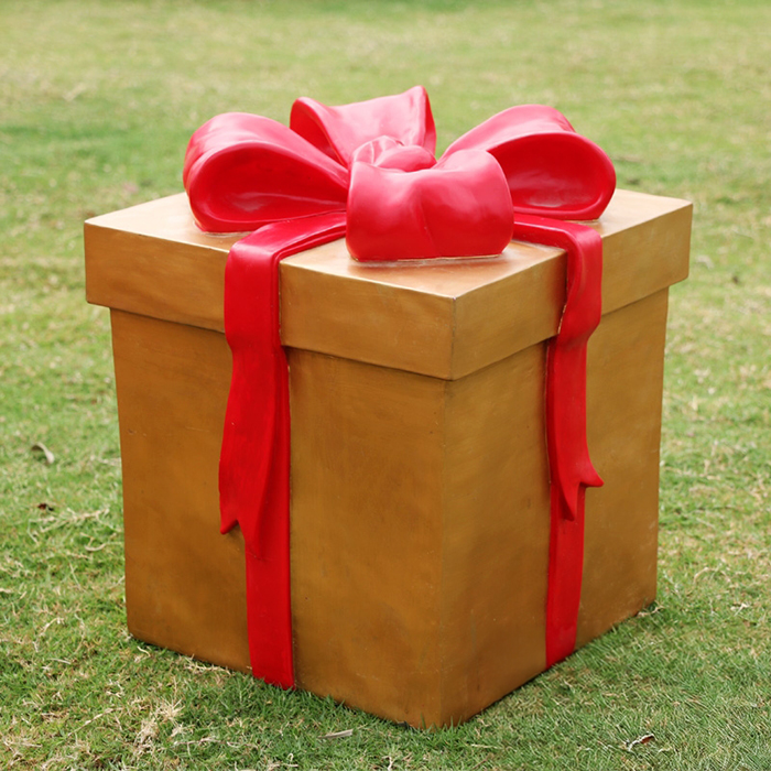 Golden Large Christmas Box Sculpture with bright red ribbon