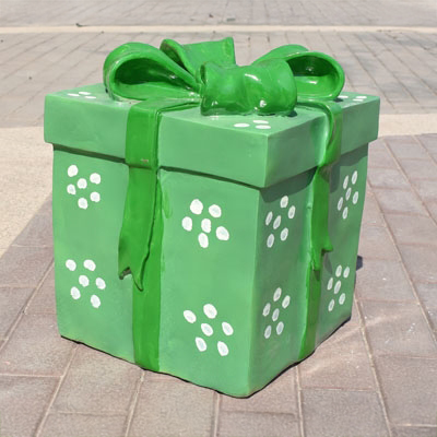 Green fiberglass Gift Box Sculpture with white dot pattern
