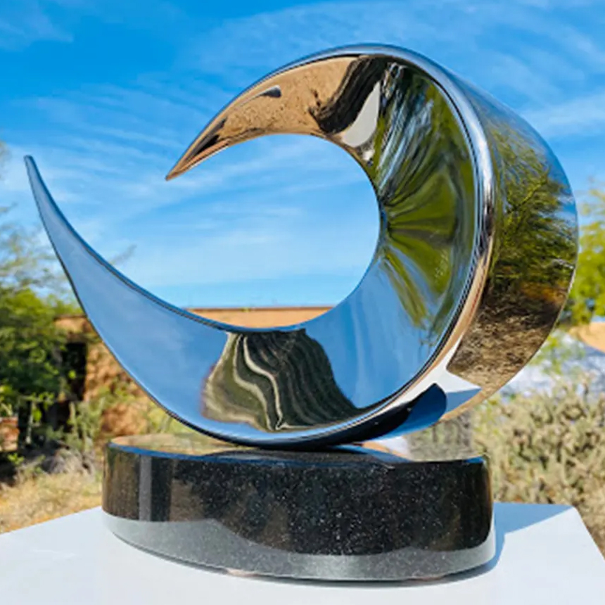 Large Abstract Dove Statue in polished stainless steel titled Resting Dove by Ryan T. Schmidt, reflecting elegance and peace