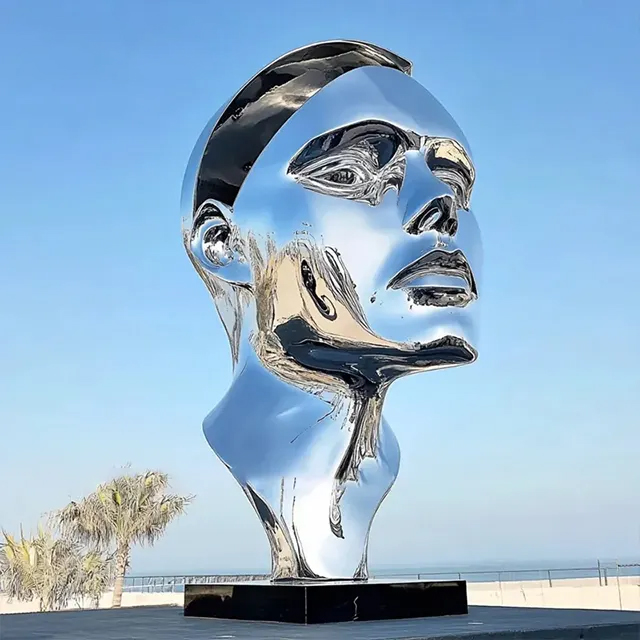 Large Face Sculpture in stainless steel with geometric textured detail