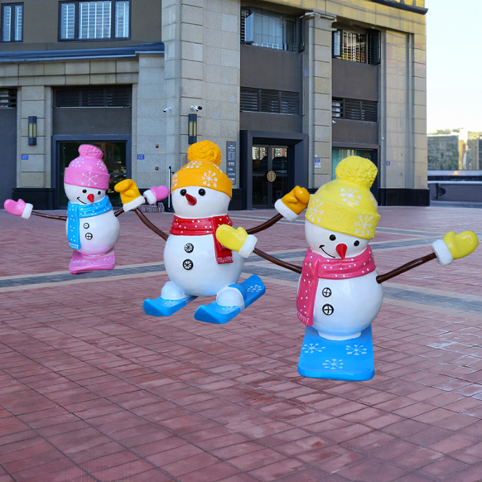 Large Outdoor Resin Snowman group with colorful hats with arms raised