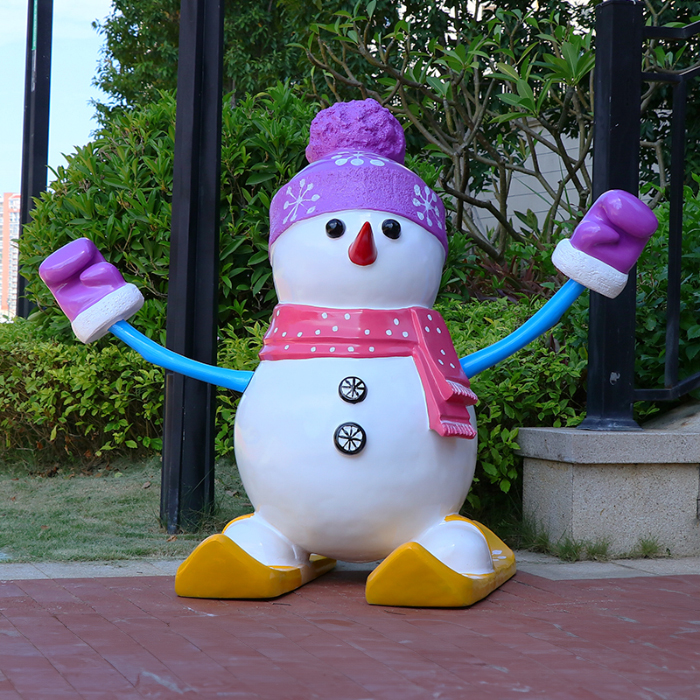 Large Outdoor Resin Snowman wearing purple hat and pink scarf with arms raised