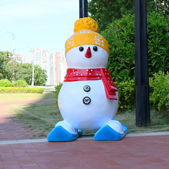 Large Outdoor Resin Snowman with yellow hat and red scarf standing on blue skis