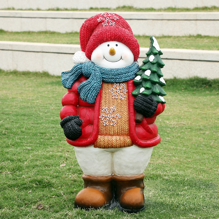 Large Snowman Statue in fiberglass carrying a Christmas tree
