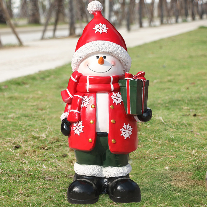 Large Snowman Statue made of fiberglass holding a green gift box
