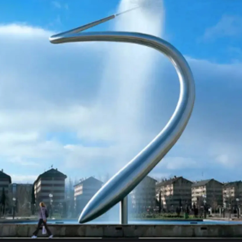 Large Stainless Steel Water Feature shaped like a giant curved needle