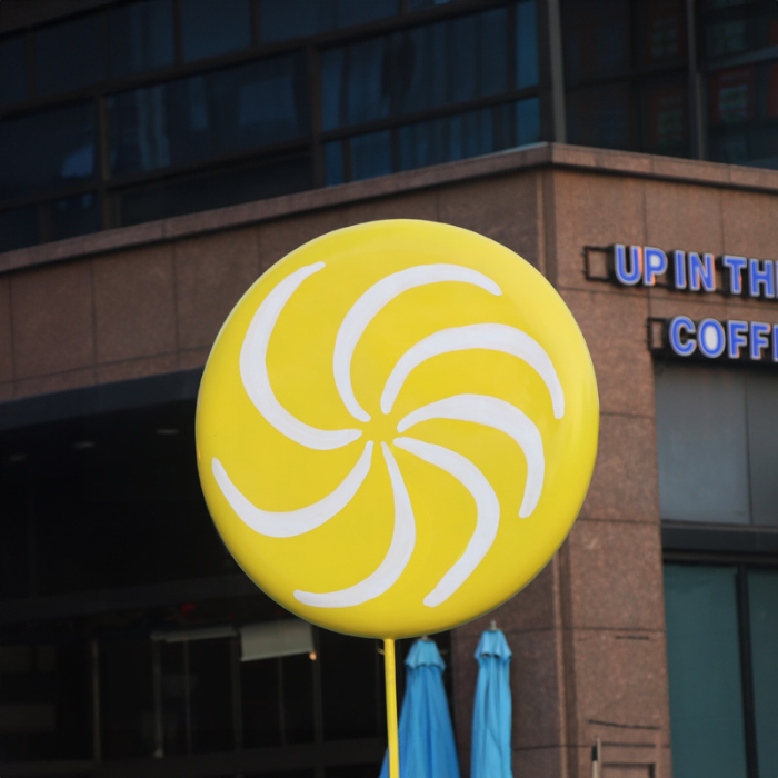 Large Swirl Lollipop Statue fiberglass in bright yellow with white spiral design